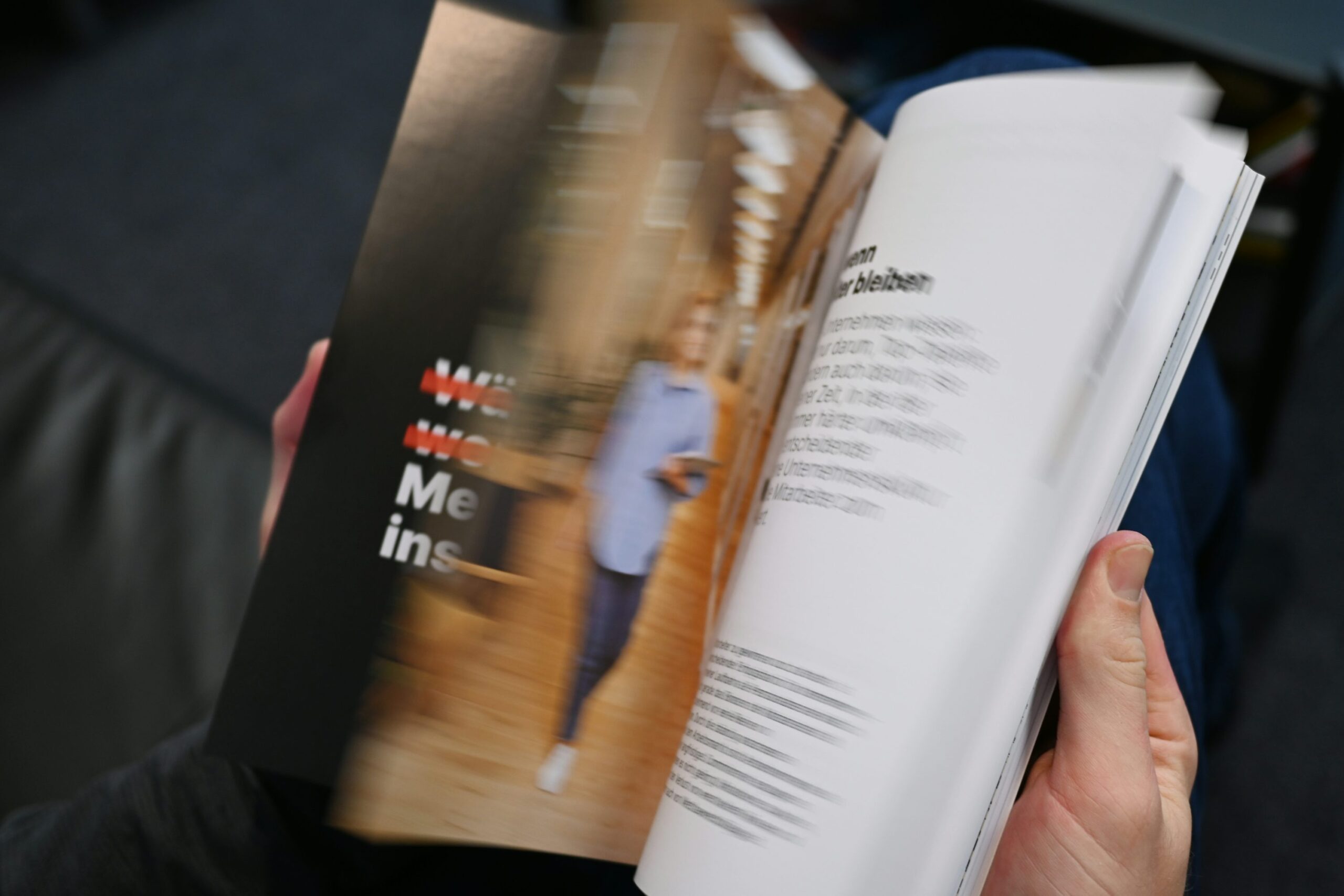 a person holding a book in their hands