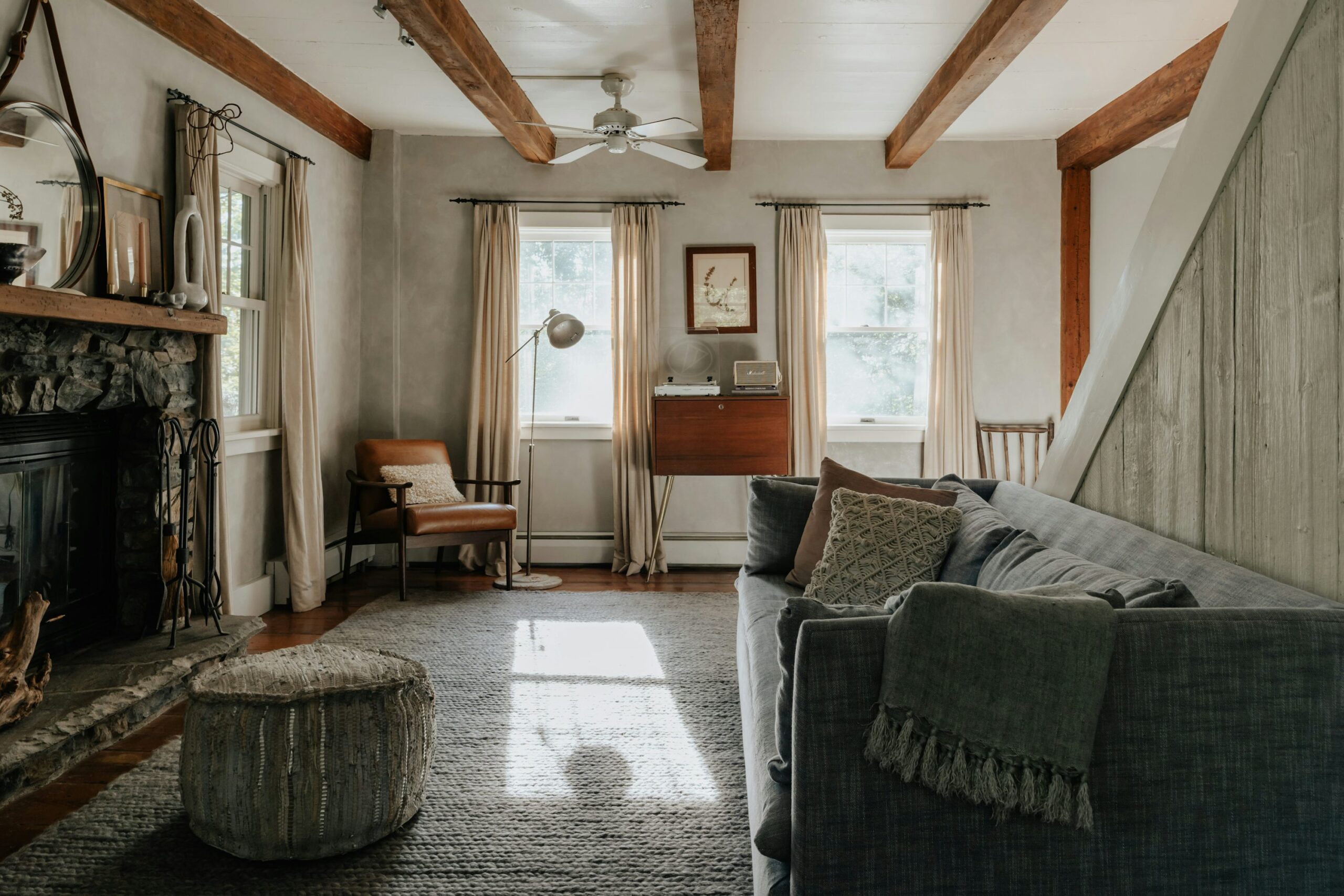 A living room filled with furniture and a fire place